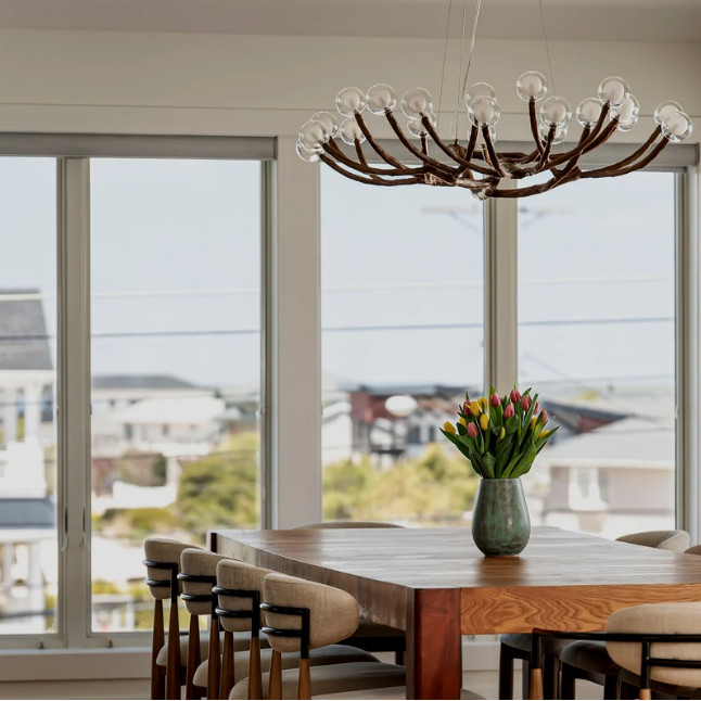 Breakfast nook overlooking LBI in a luxury custom home on LBI with coastal inspired details including decor and color palette with wood floors throughout | Stonehenge Built | LBI custom home | custom home on LBI | Stonehenge Building | Best LBI Custom Home Builder